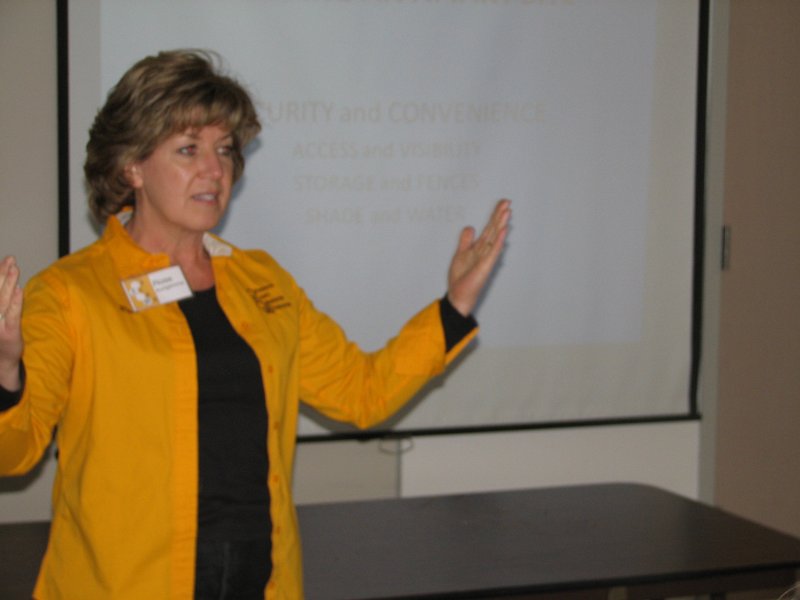 beecourse_day1 033.JPG - Rose took a break from maintaining the Canteen to explain the do's and don'ts of hive placement and how to be a good beekeeping neighbor.